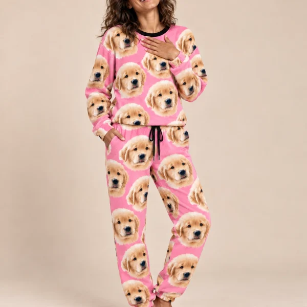 Woman wearing womens jogger pajamas covered in golden retriever puppy faces on pink fabric — MyDogPics
