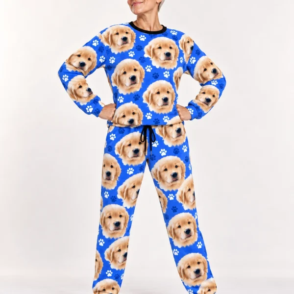 Woman wearing womens jogger pajamas covered in golden retriever puppy faces on royal blue paw-print fabric — MyDogPics