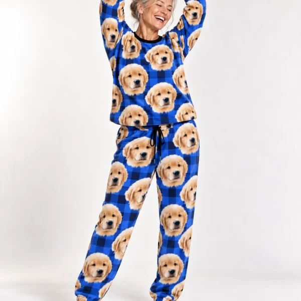 Woman posing in womens jogger pajamas, golden retriever puppy faces on blue plaid fabric — MyDogPics