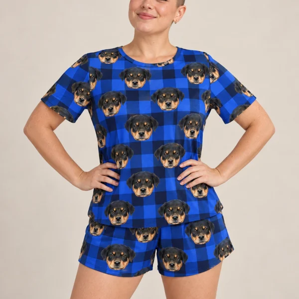Woman wearing womens sleepwear covered in Rottweiler puppy faces on blue plaid fabric — MyDogPics