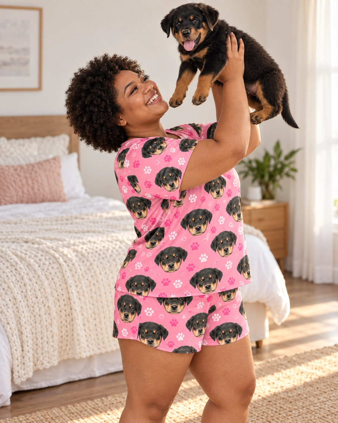 Women’s Sleepwear – Holding Dog, Pink Paw-Print | MyDogPics Woman in womens sleepwear holding her Rottweiler puppy — MyDogPics