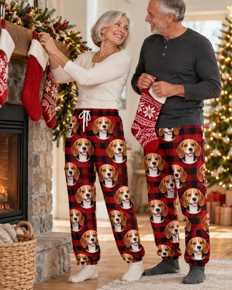 Woman and her partner in matching beagle Christmas pajama pants with tricolor Beagle (black, tan and white) faces — MyDogPics