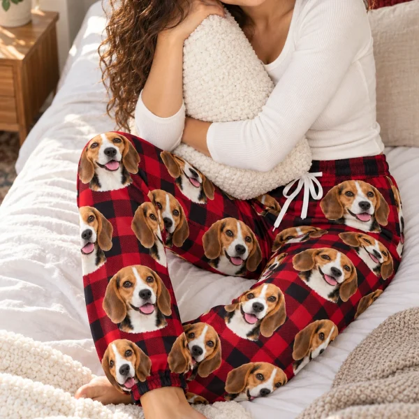 Woman sitting in beagle Christmas pajama pants covered in tricolor Beagle (black, tan and white) faces — MyDogPics