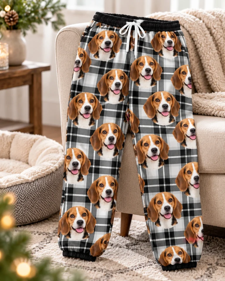 Flat lay of beagle pajama pants: pants covered in tricolor Beagle (black, tan and white) faces — MyDogPics