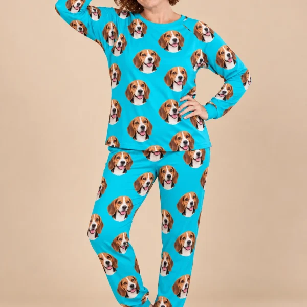Woman wearing a beagle pajamas for adults covered in tricolor Beagle (black, tan and white) faces on teal fabric — MyDogPics