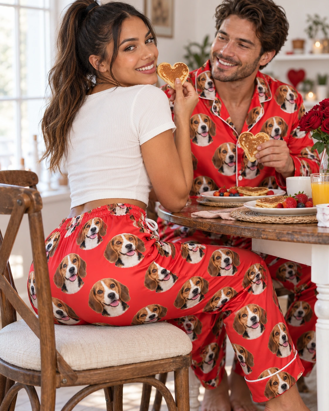 Beagle Valentine Pajamas – Family, Red | MyDogPics Woman and her partner in matching beagle Valentine pajamas with tricolor Beagle (black, tan and white) faces — MyDogPics
