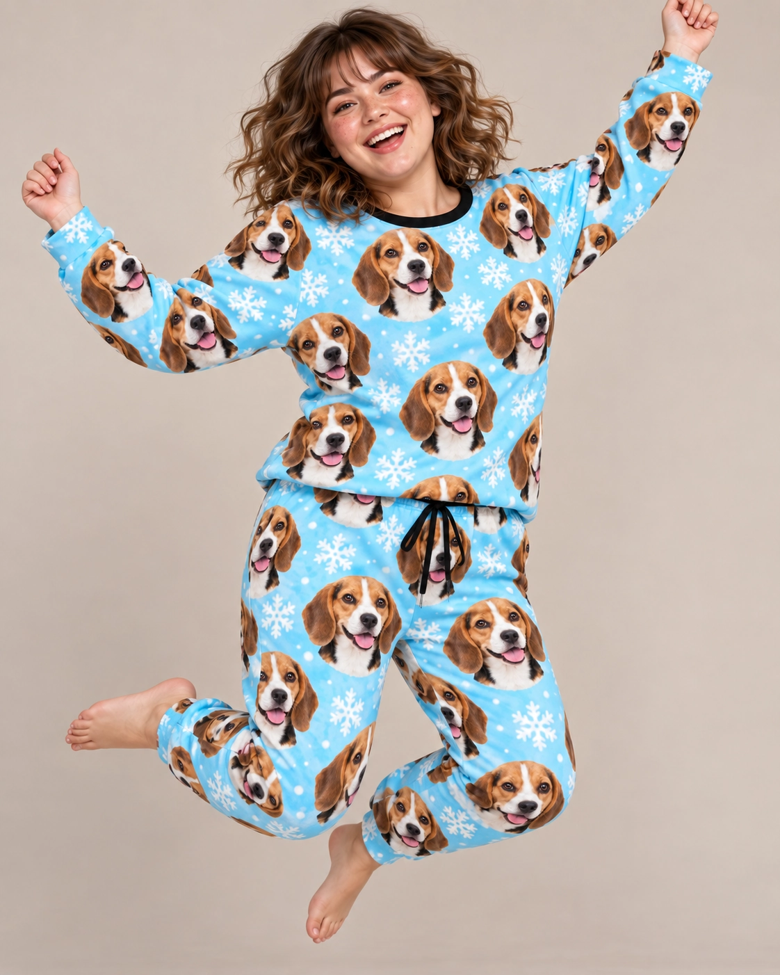 Beagle Winter Pajamas – Pose, Light Blue Snowflake | MyDogPics Woman posing in beagle winter pajamas with tricolor Beagle (black, tan and white) faces — MyDogPics
