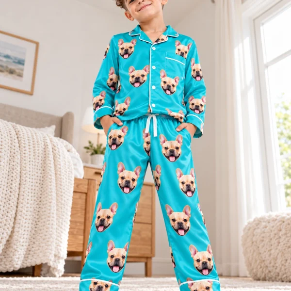 Boy posing in boys long sleeve pajamas, fawn French bulldog faces on teal satin — MyDogPics