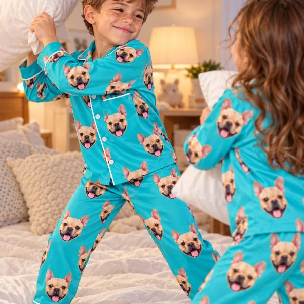 Two kids in boys long sleeve pajamas with fawn French bulldog faces on teal satin — MyDogPics