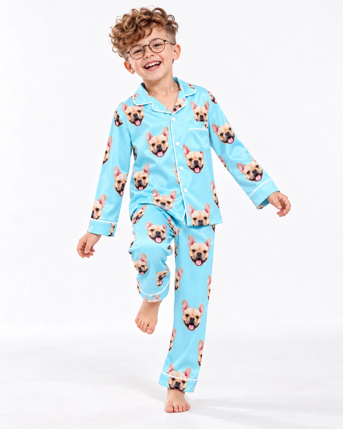 Boys Pajama Sets – Front View, Light Blue | MyDogPics Boy wearing a boys pajama sets covered in fawn French bulldog faces on light blue satin — MyDogPics