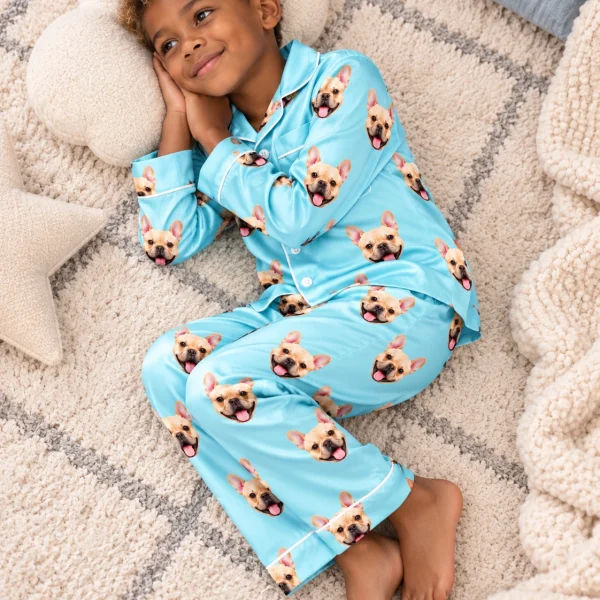 Boy posing in a boys pajama sets, fawn French bulldog faces on light blue satin — MyDogPics