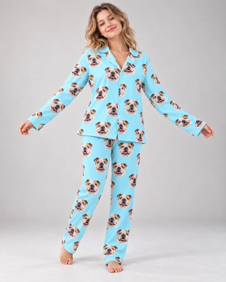 Woman posing in british bulldog pajamas, white-and-fawn English Bulldog faces on light blue fabric — MyDogPics