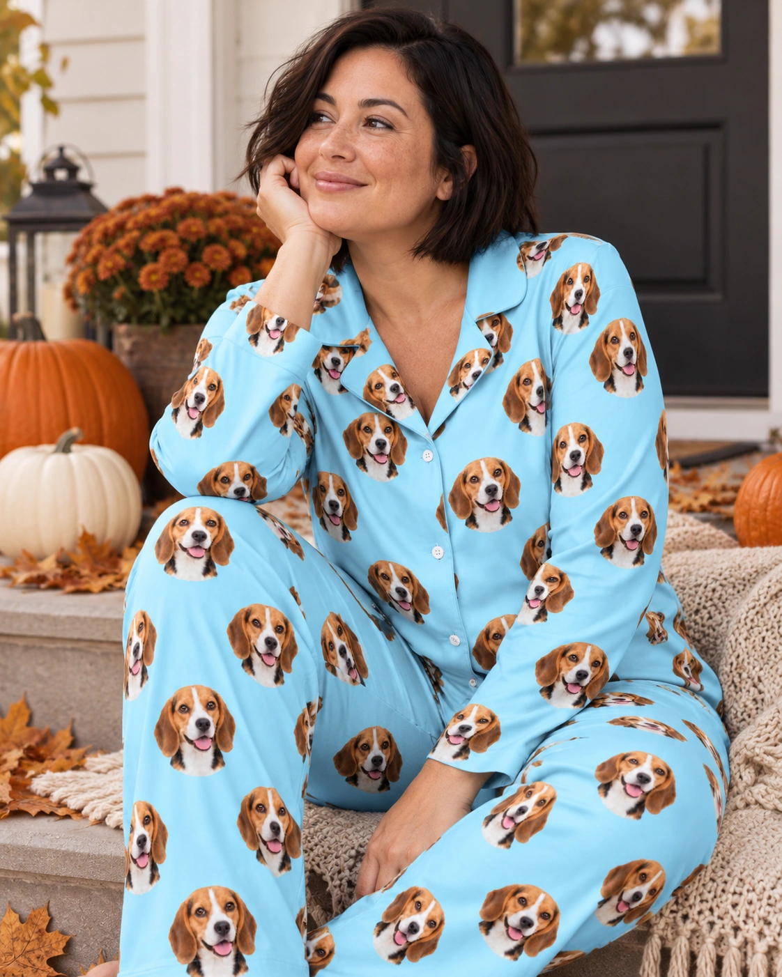 Custom Beagle Pajamas – Sitting, Light Blue | MyDogPics Woman sitting in custom beagle pajamas covered in tricolor Beagle (black, tan and white) faces — MyDogPics