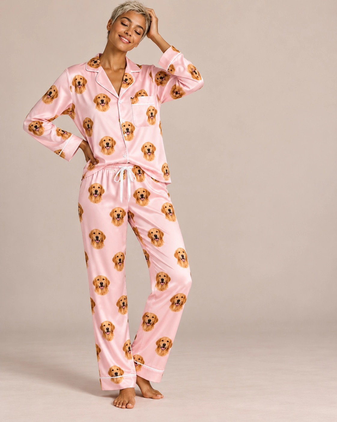 Custom Golden Retriever Pajamas for Women – Front View, Blush Pink | MyDogPics Woman wearing a custom golden retriever pajamas for women covered in golden Golden Retriever faces — MyDogPics