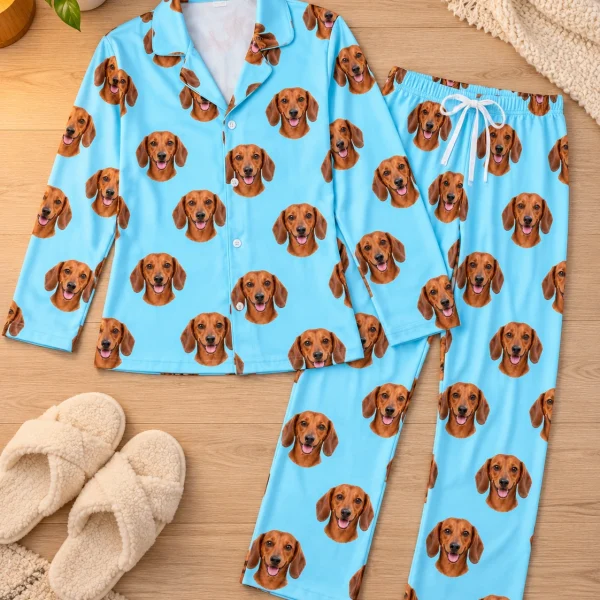 Flat lay of doxie pajamas: shirt and pants covered in red smooth-coated Dachshund faces — MyDogPics