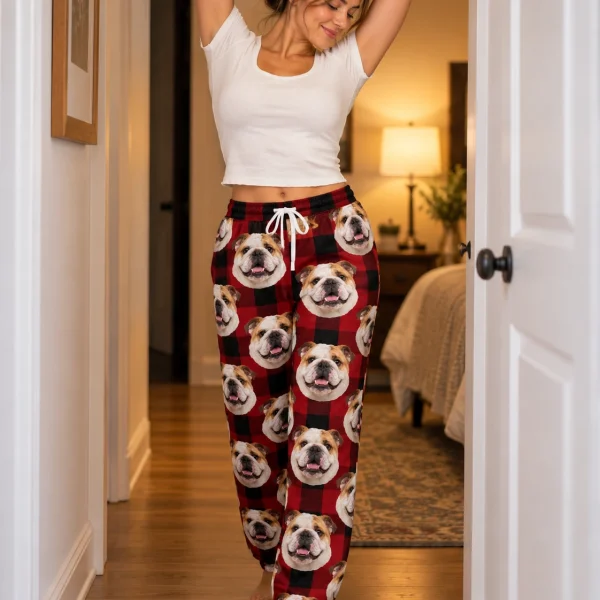 Woman wearing english bulldog Christmas pajama pants covered in white-and-fawn English Bulldog faces — MyDogPics