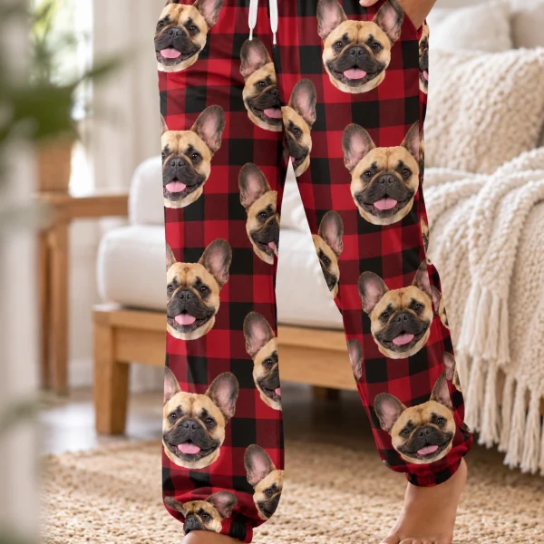 Close-up of the French bulldog Christmas pajama pants print: fawn French Bulldog faces on red plaid fabric — MyDogPics