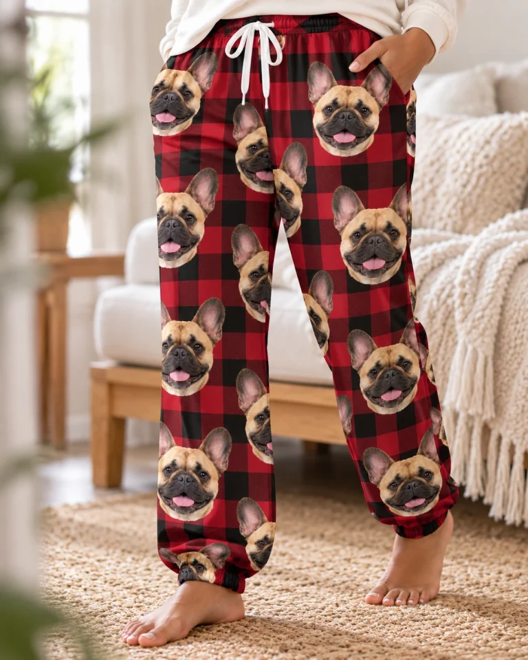 Close-up of the French bulldog Christmas pajama pants print: fawn French Bulldog faces on red plaid fabric — MyDogPics
