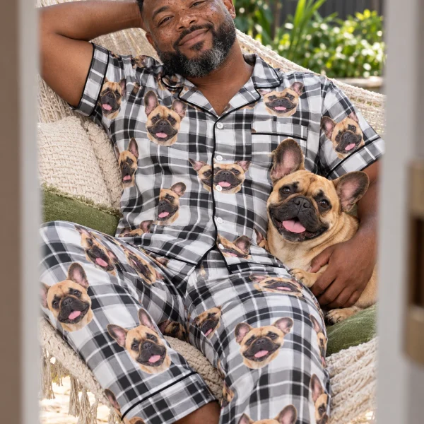 Man in French bulldog dad pajamas cuddling his French Bulldog — MyDogPics