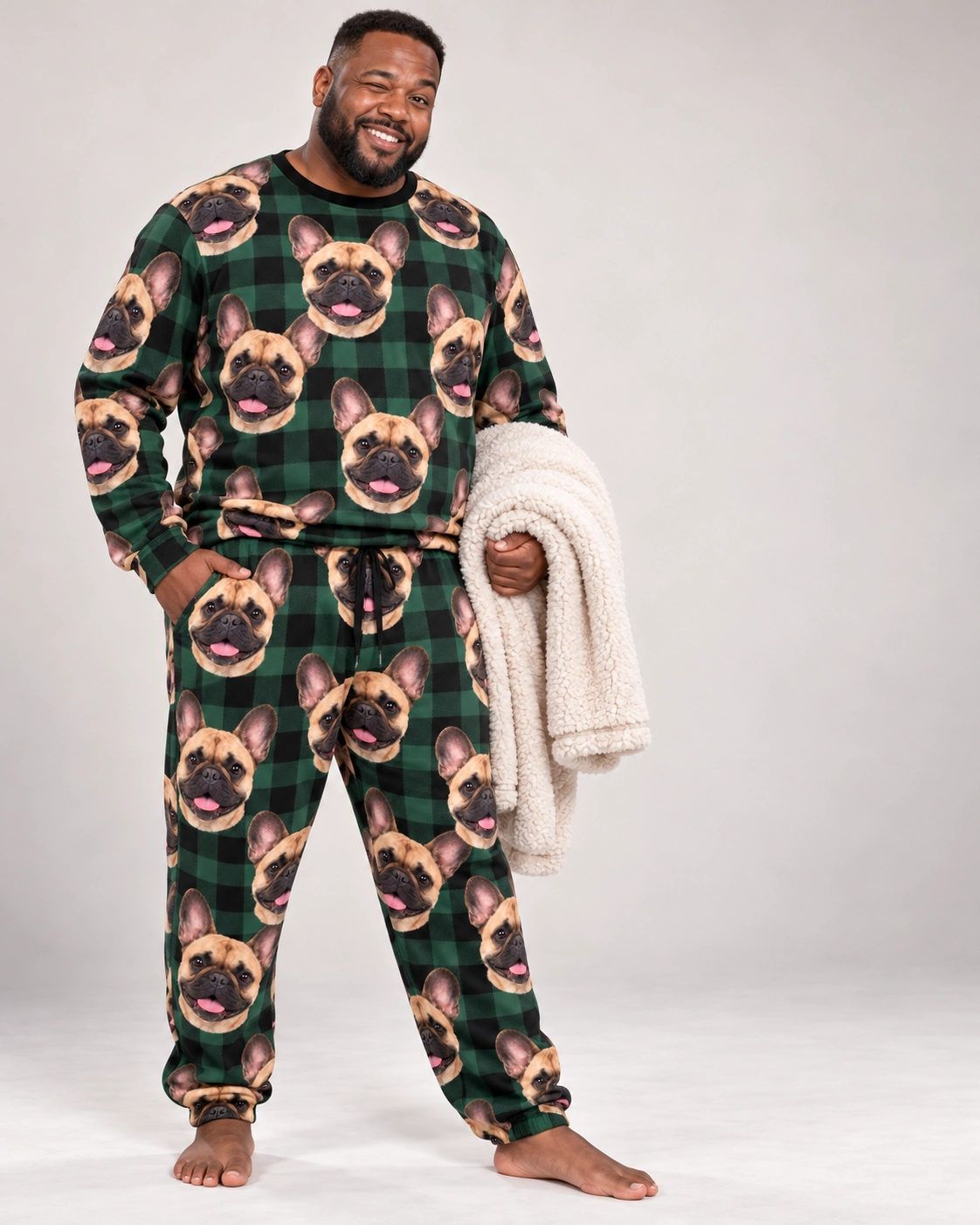 French Bulldog Pajama Set – Front View, Green Plaid | MyDogPics Man wearing a French bulldog pajama set covered in fawn French Bulldog faces on green plaid fabric — MyDogPics