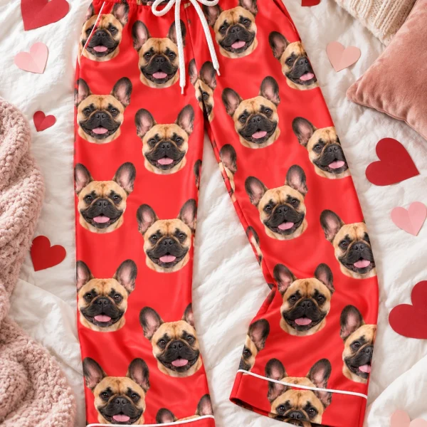 Flat lay of French bulldog Valentine pajamas: pants covered in fawn French Bulldog faces — MyDogPics