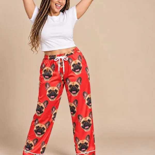 Woman posing in French bulldog Valentine pajamas, fawn French Bulldog faces on red satin — MyDogPics
