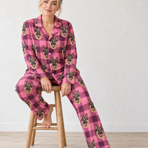 Woman sitting in German shepherd mom pajamas covered in black-and-tan German Shepherd faces — MyDogPics