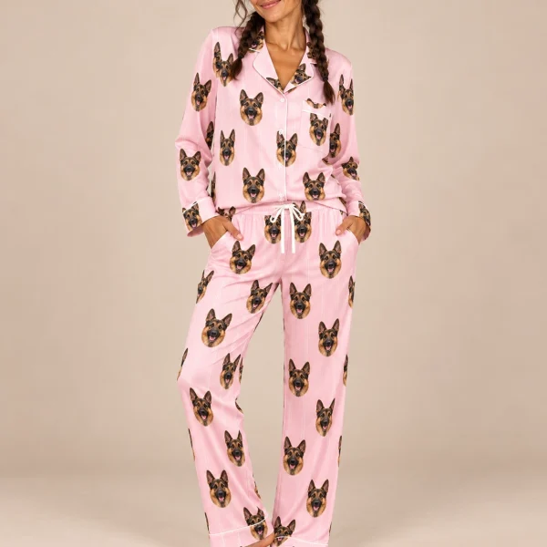 Woman sitting in a German shepherd pajamas for women covered in black-and-tan German Shepherd faces — MyDogPics