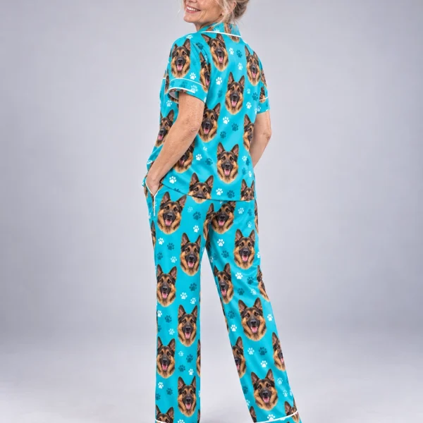 Woman sitting in German shepherd print pajamas covered in black-and-tan German Shepherd faces — MyDogPics