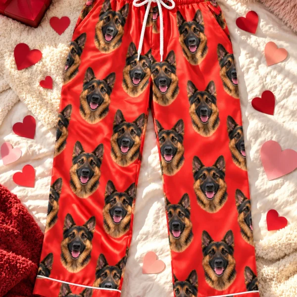 Flat lay of German shepherd Valentine pajamas: pants covered in black-and-tan German Shepherd faces — MyDogPics