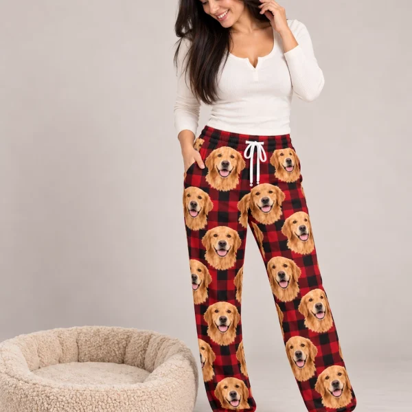 Woman wearing golden retriever Christmas pajama pants covered in golden Golden Retriever faces — MyDogPics