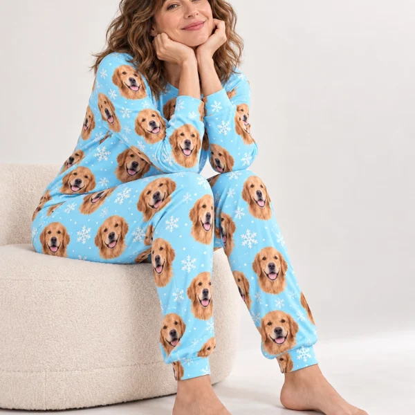 Woman sitting in golden retriever matching pajamas covered in golden Golden Retriever faces — MyDogPics