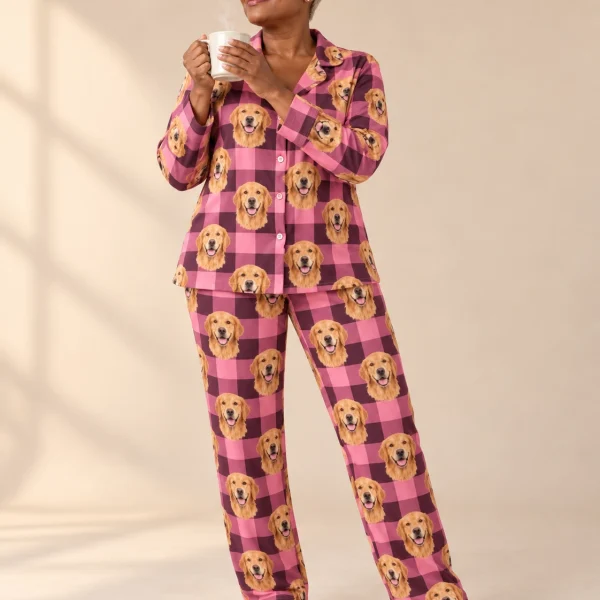 Woman wearing golden retriever mom pajamas covered in golden Golden Retriever faces on pink plaid fabric — MyDogPics