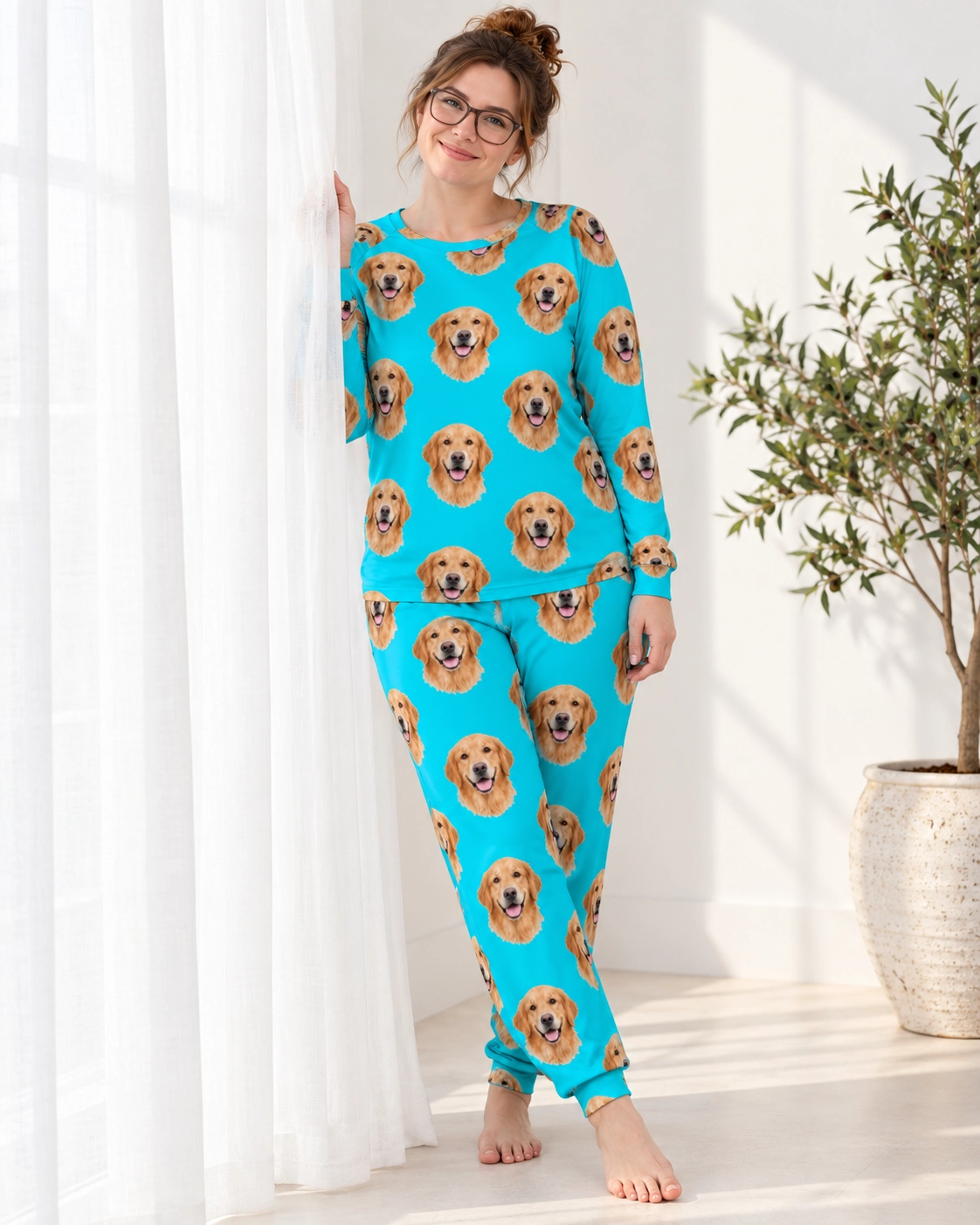Golden Retriever Pajamas for Adults – Front View, Teal | MyDogPics Woman wearing a golden retriever pajamas for adults covered in golden Golden Retriever faces on teal fabric — MyDogPics