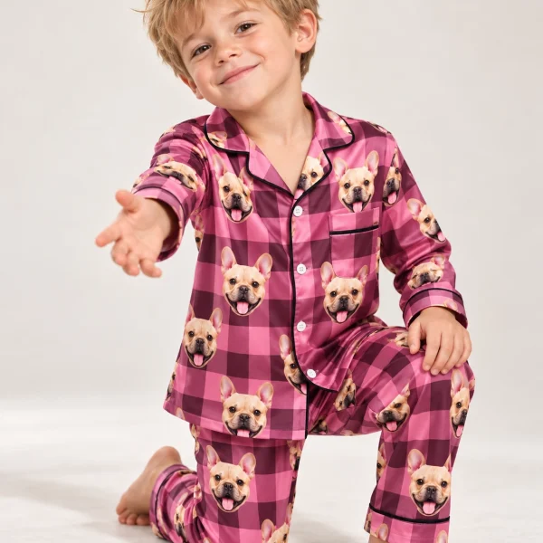 Boy posing in kids button down pajamas, fawn French bulldog faces on pink plaid satin — MyDogPics