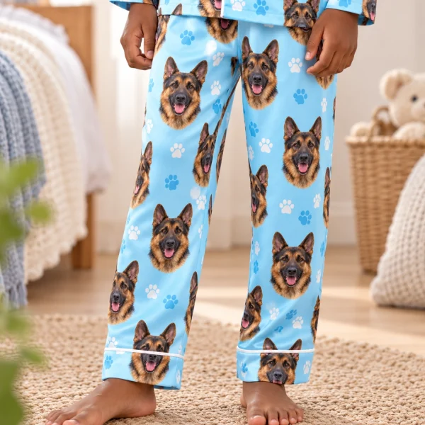 Boy sitting in kids German shepherd pajamas covered in black-and-tan German Shepherd faces — MyDogPics