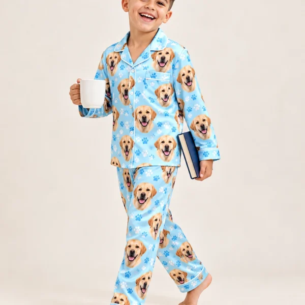 Boy posing in kids labrador pajamas, yellow Labrador Retriever faces on light blue paw-print satin — MyDogPics