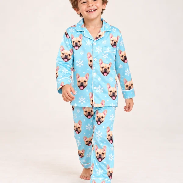 Boy wearing kids new years pajamas covered in fawn French bulldog faces on blue snowflake satin — MyDogPics