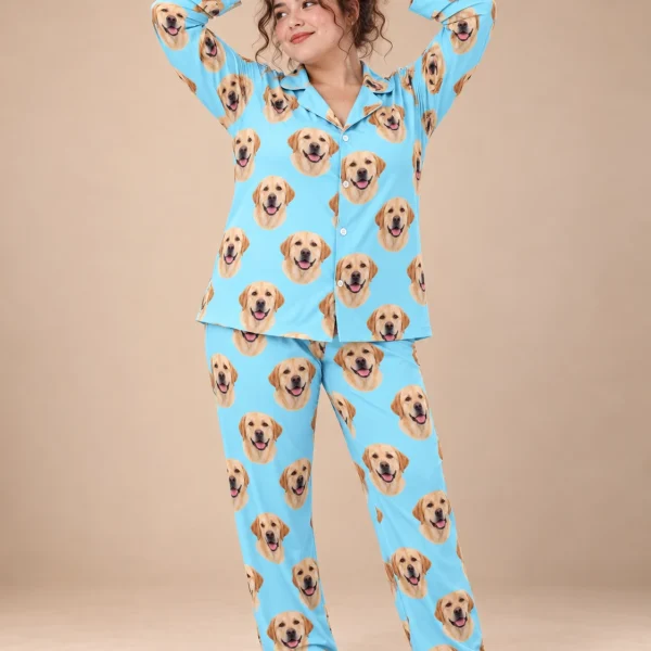 Woman wearing lab pajamas covered in yellow Labrador Retriever faces on light blue fabric — MyDogPics
