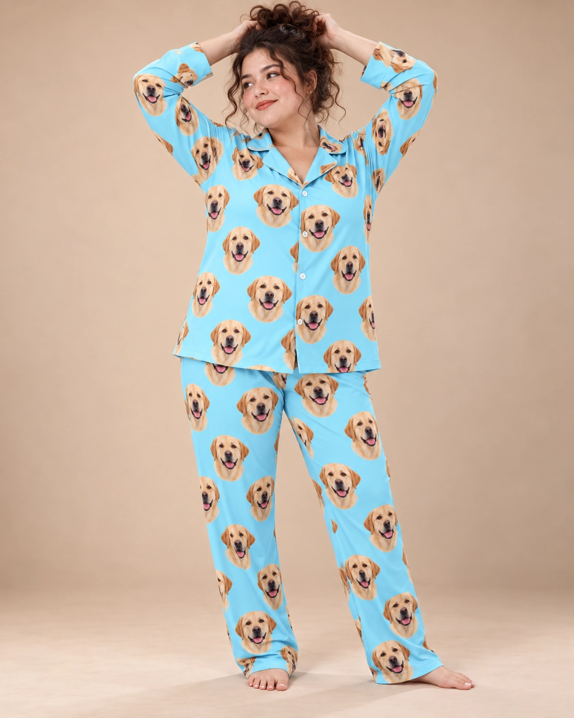 Lab Pajamas – Front View, Light Blue | MyDogPics Woman wearing lab pajamas covered in yellow Labrador Retriever faces on light blue fabric — MyDogPics