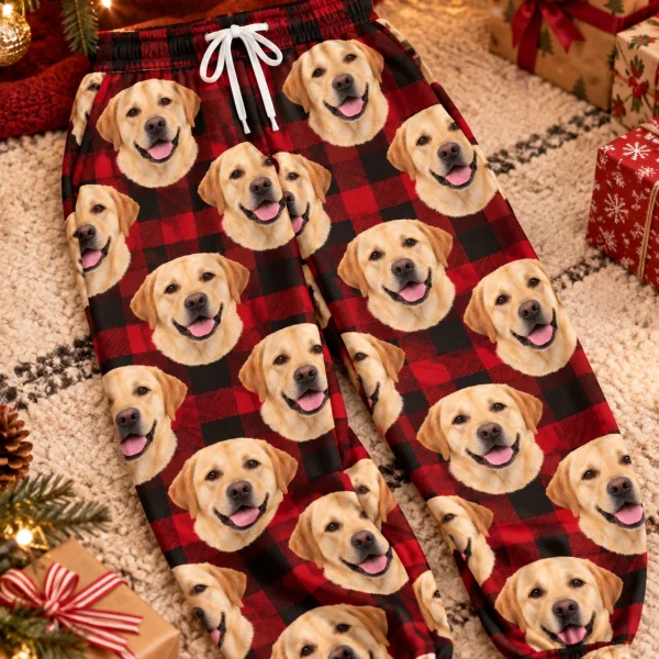 Flat lay of labrador Christmas pajama pants: pants covered in yellow Labrador Retriever faces — MyDogPics
