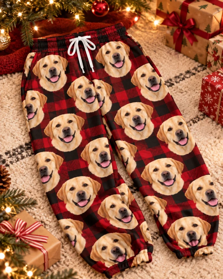 Flat lay of labrador Christmas pajama pants: pants covered in yellow Labrador Retriever faces — MyDogPics