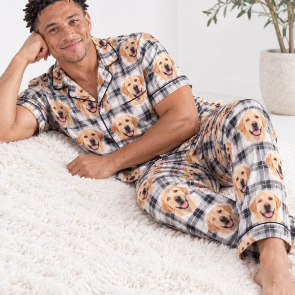 Man sitting in labrador dad pajamas covered in yellow Labrador Retriever faces — MyDogPics