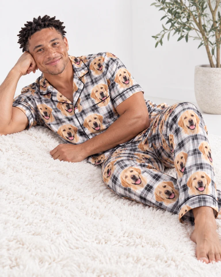 Man sitting in labrador dad pajamas covered in yellow Labrador Retriever faces — MyDogPics