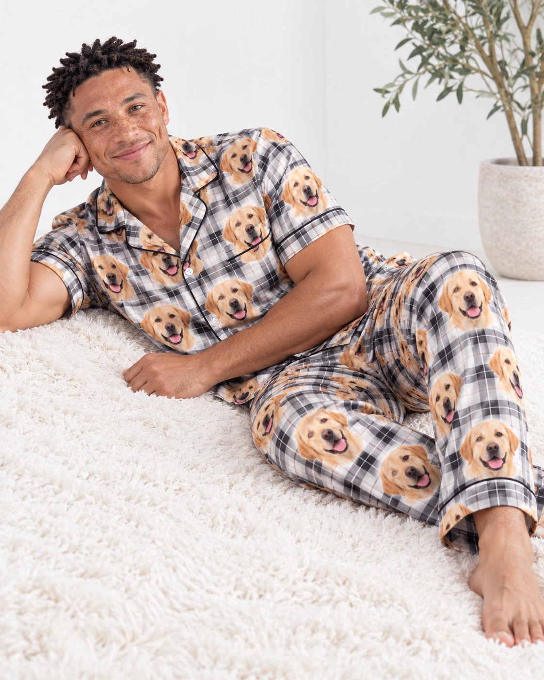 Labrador Dad Pajamas – Sitting, White Plaid | MyDogPics Man sitting in labrador dad pajamas covered in yellow Labrador Retriever faces — MyDogPics