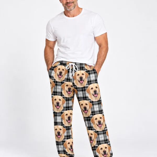 Man wearing labrador pajama pants covered in yellow Labrador Retriever faces on white plaid fabric — MyDogPics