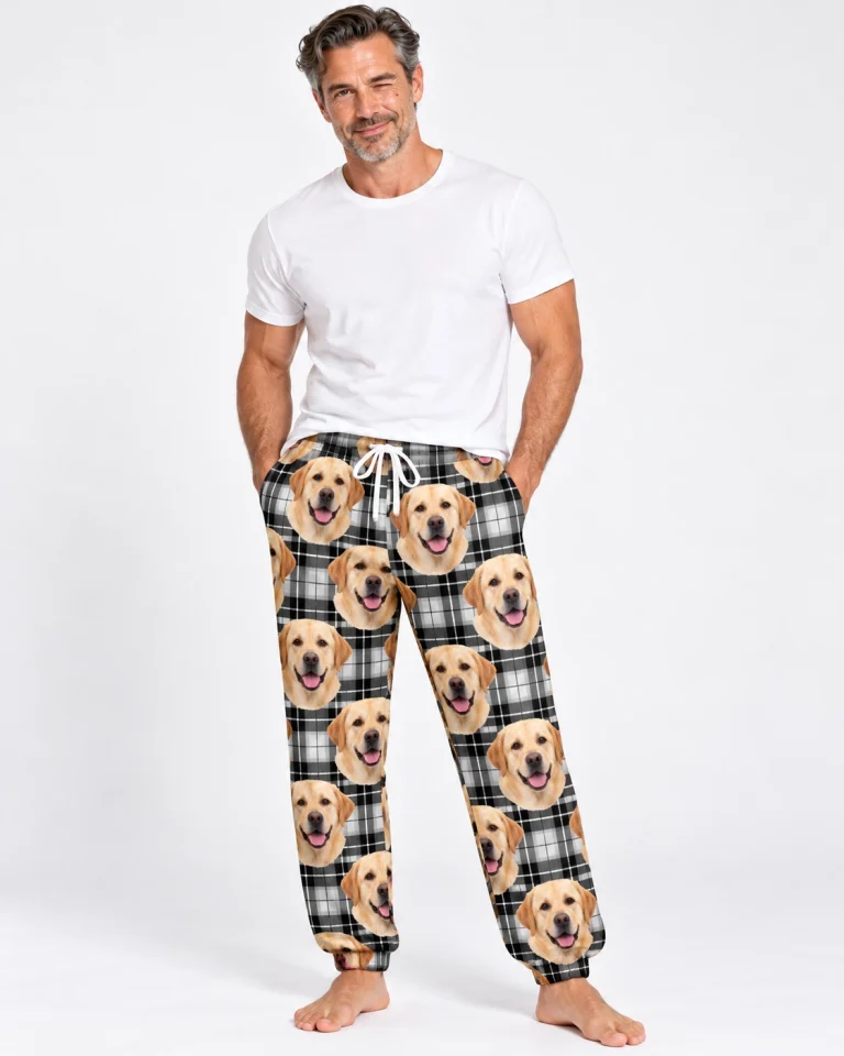 Man wearing labrador pajama pants covered in yellow Labrador Retriever faces on white plaid fabric — MyDogPics
