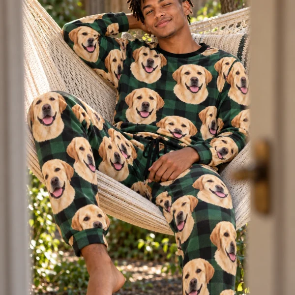 Man sitting in a labrador pajama set covered in yellow Labrador Retriever faces — MyDogPics