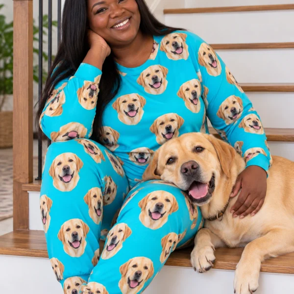 Woman in a labrador pajamas for adults cuddling her Labrador Retriever — MyDogPics