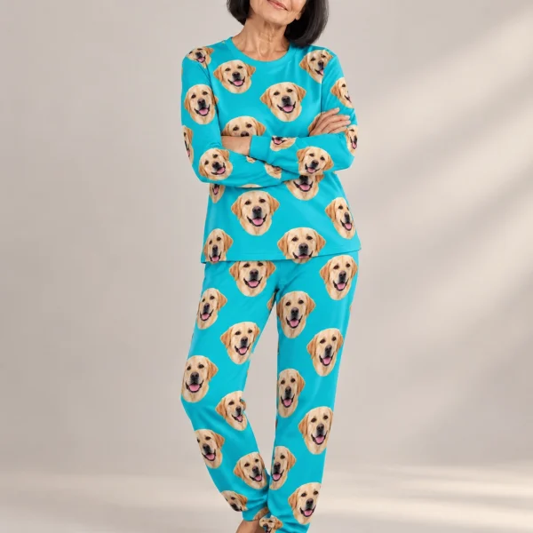 Woman wearing a labrador pajamas for adults covered in yellow Labrador Retriever faces on teal fabric — MyDogPics
